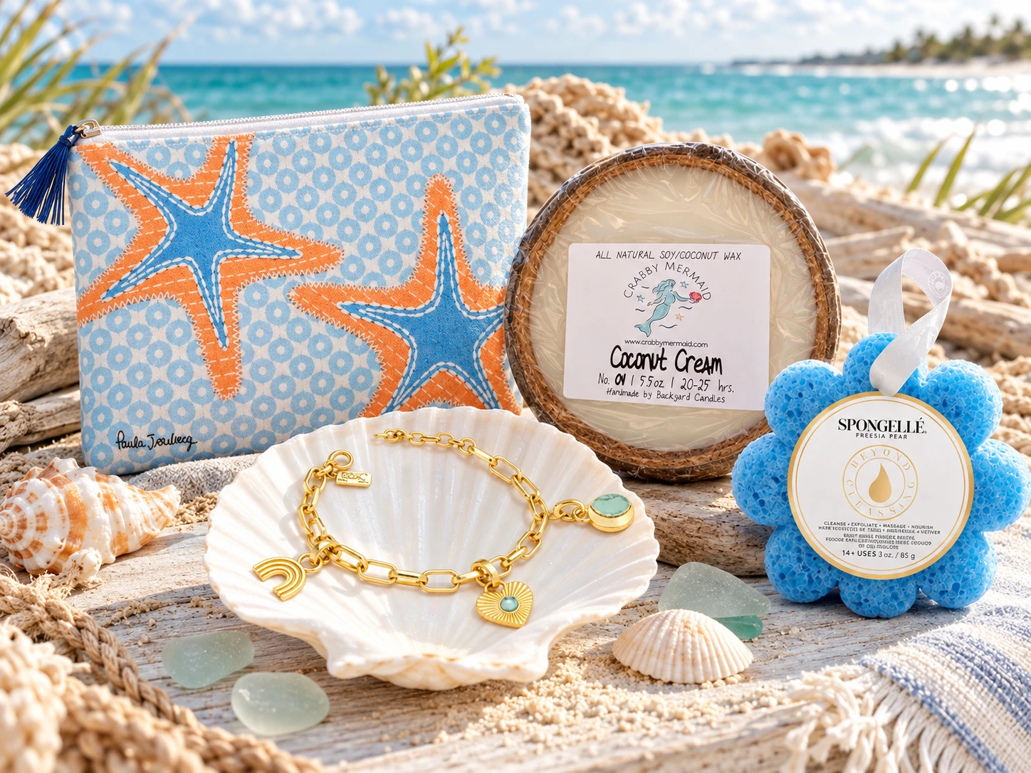 Coastal holiday gifts under $50 featuring a starfish cosmetic pouch, coconut candle, Spongelle bath sponge and gold charm bracelet - Crabby Mermaid