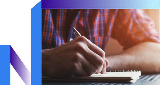 A person writing in a notebook, capturing thoughts with a pen.