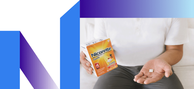 Man looks at gum contemplating chewing.