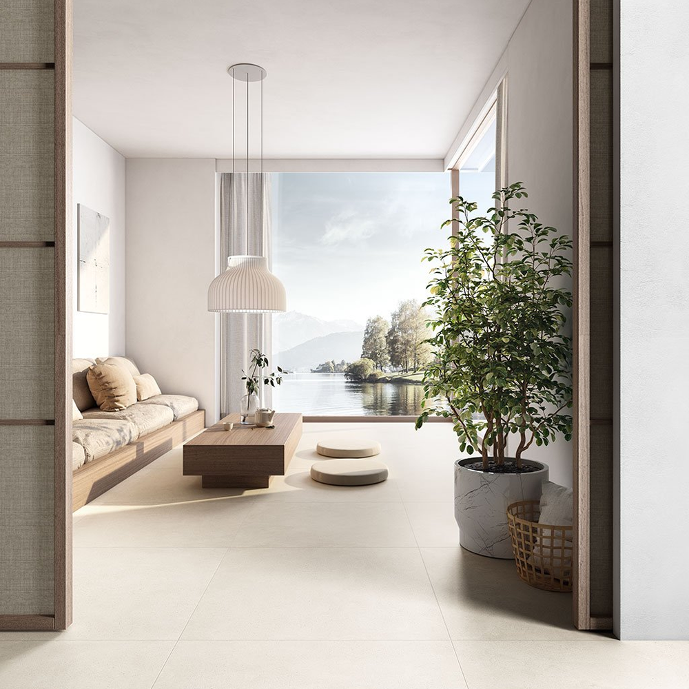 Kintsugi large format 24 x 24 tile in an open feeling living room with glass windows