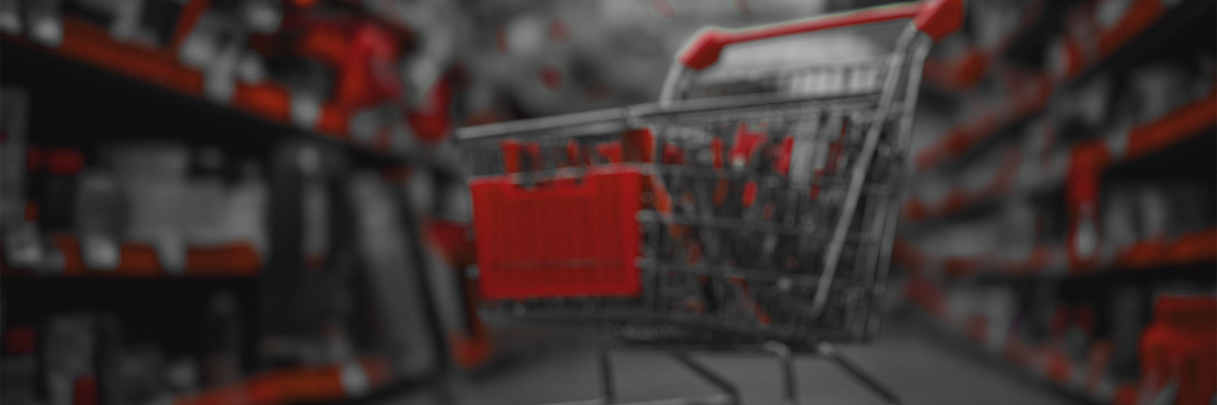 Red shopping cart in warehouse