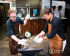 Participants forging steel together during a Nordic Edge blacksmithing class in Sydney