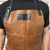 Nordic Edge leather apron logo and adjustable neck strap detail