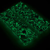 Same shredded carbon fiber handle scales glowing green in the dark after light exposure