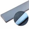 5-layer stainless San Mai steel billet with finished knife blade showing laminate line