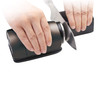 Taidea TG2402 electric rolling knife sharpener being used on a kitchen knife