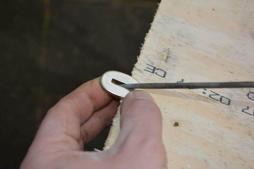 Using a needle file small enough to get inside the bolster, round the edges and make the slit longer if required. Keep test fitting on the blade until it fits all the way up.