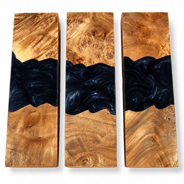 Three hybrid stabilised burl and black resin knife handle blocks showing natural wood grain and swirling black resin patterns.