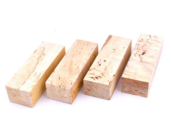 Natural curly birch handle blocks showing standard grade grain