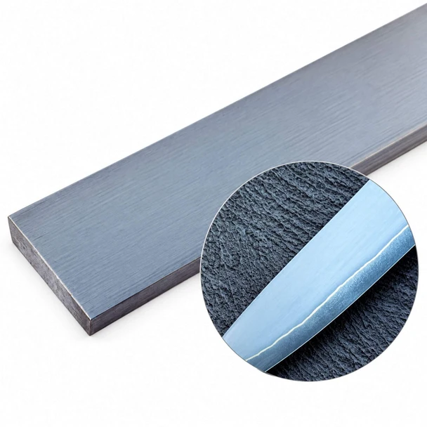 5-layer stainless San Mai steel billet with finished knife blade showing laminate line