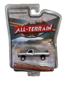 Greenlight 1992 Dodge Ram D250 Power Ram Lifted with Rollbar Silver 1/64