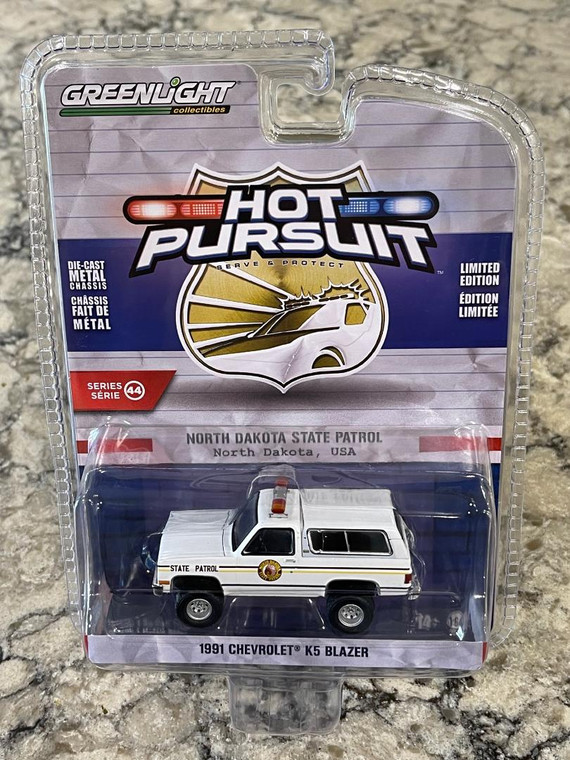 Greenlight Hot Pursuit 1991 North Dakota State Patrol Chevrolet K5 Blazer 1/64