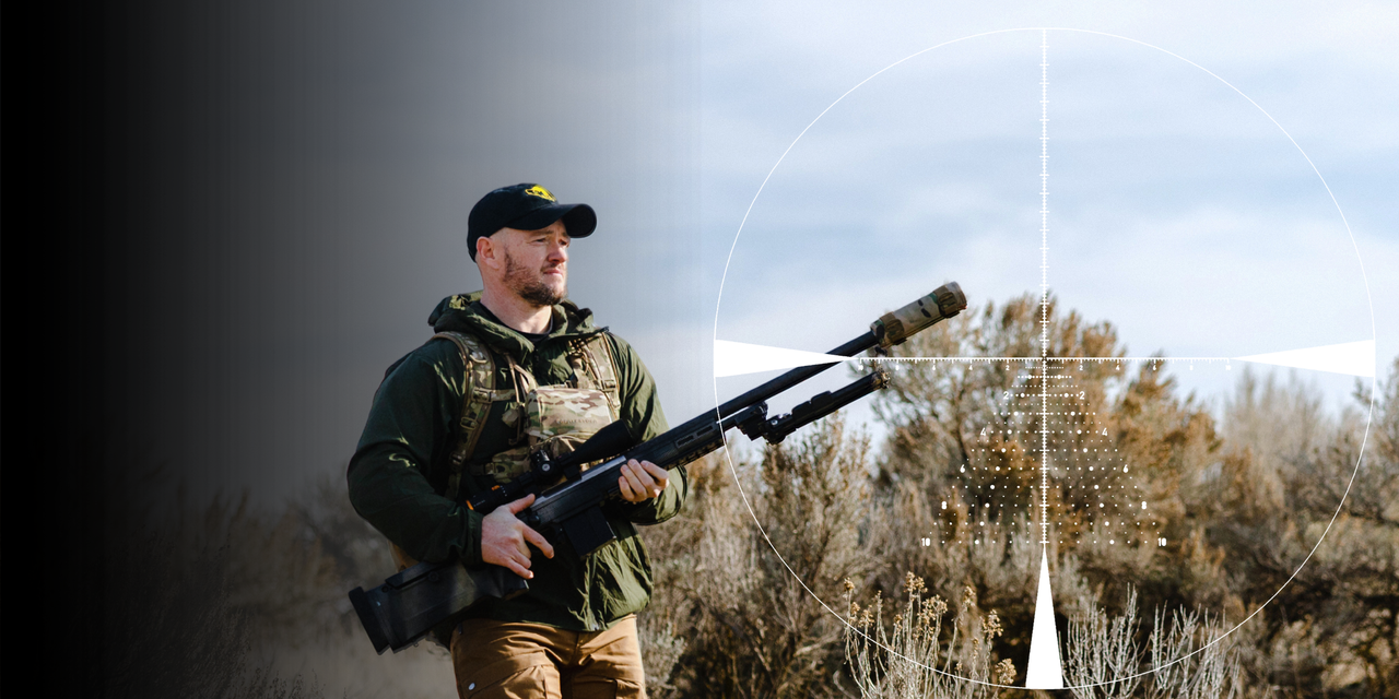 Man carrying weapon with Horus TREMOR9 Reticle