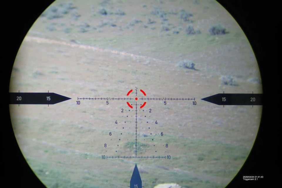 Precision rifle with Horus optic in field terrain