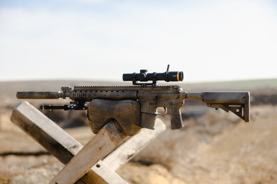Precision rifle with Horus optic in field terrain
