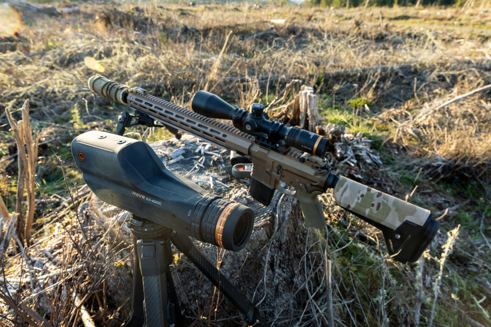 Precision rifle with Horus optic in field terrain