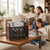 Family reading books with wooden magazine holder on table, home magazine organizer for living room