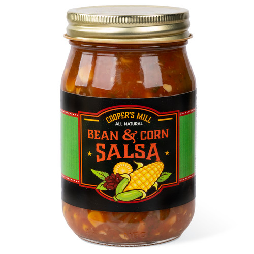 A 16-ounce glass jar of Cooper's Mill Bean & Corn Salsa  with gold screw-on lid. Black and green label shows illustrations of corn and beans.