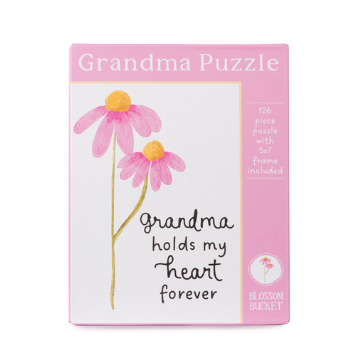 A boxed Blossom Bucket Grandma Puzzle set featuring pink watercolor coneflowers and the text "grandma holds my heart forever," noting 126 pieces and an included 5x7 frame.