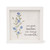 A square white-framed sign with a watercolor-style illustration of blue flowers and the text, "one great teacher can change the world."