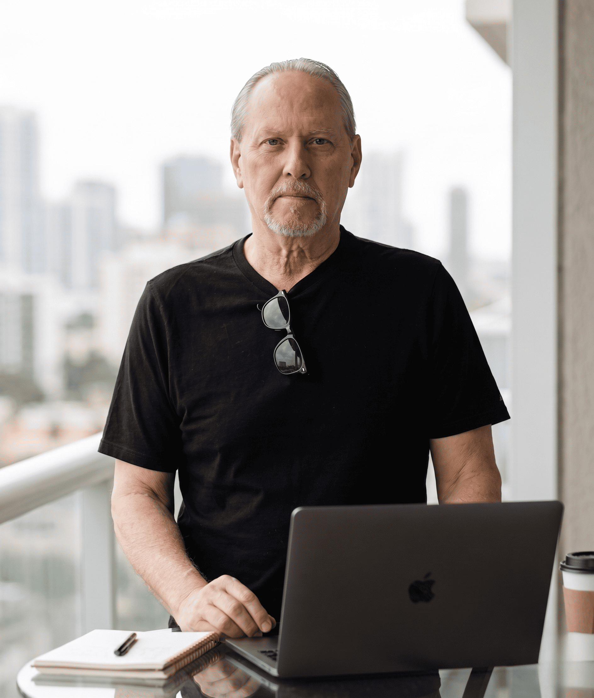 A black cotton tee worn off-camera on a work-from-home break