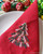 Green Christmas Tree in Red Table Napkin