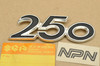 NOS Suzuki T250 Hustler Side Cover Emblem Badge 68140-18100
