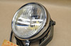 NOS Honda 1977-79 FL250 Odyssey Head Light w/ Bucket & Bracket 33100-950-003