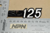 NOS Honda SL125 K0 Side Cover Emblem Logo Badge 87128-331-670