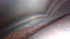 Inside floor edge of fuel tank