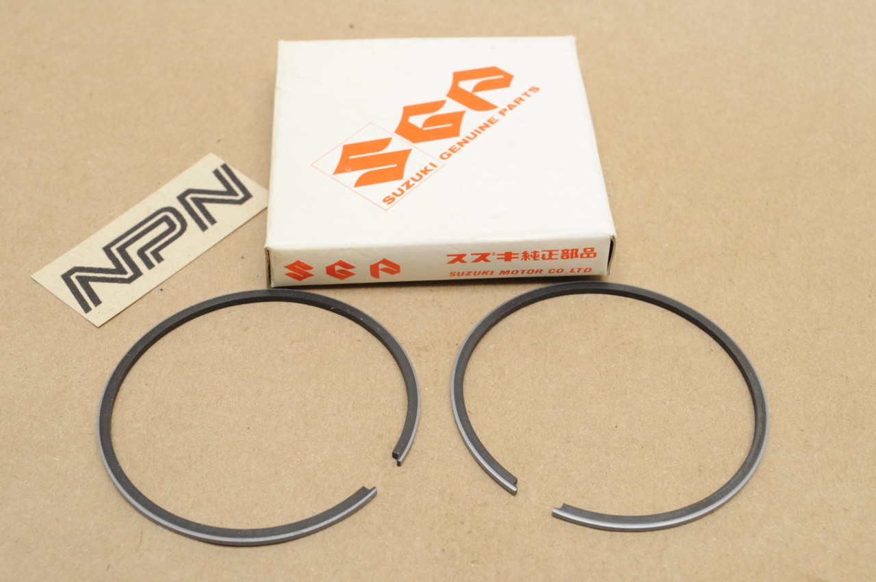 NOS Suzuki 1976-78 RM100 .25 Oversize Piston Ring Set 12140-28630-025