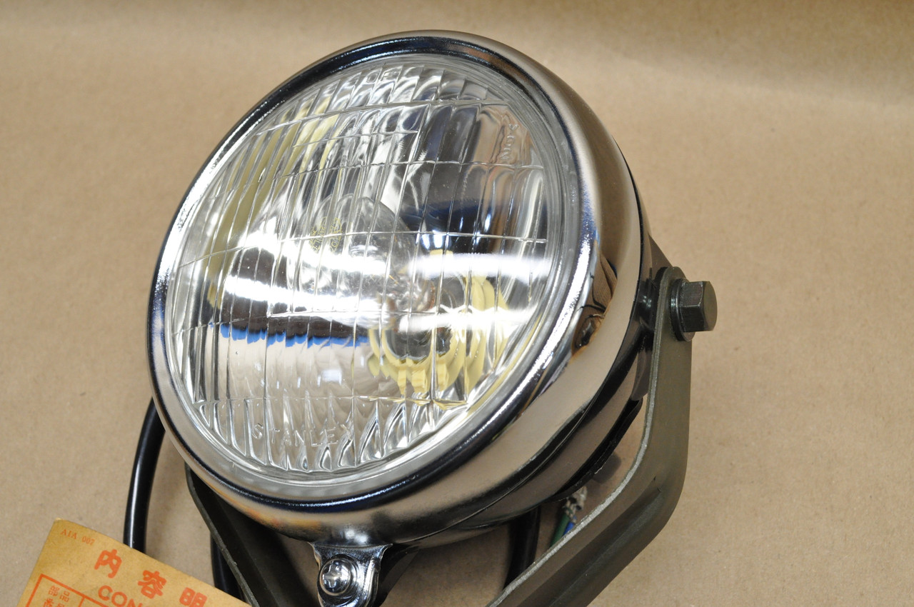 NOS Honda 1977-79 FL250 Odyssey Head Light w/ Bucket & Bracket 33100-950-003