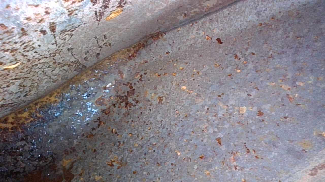 Inside right of the fuel tank