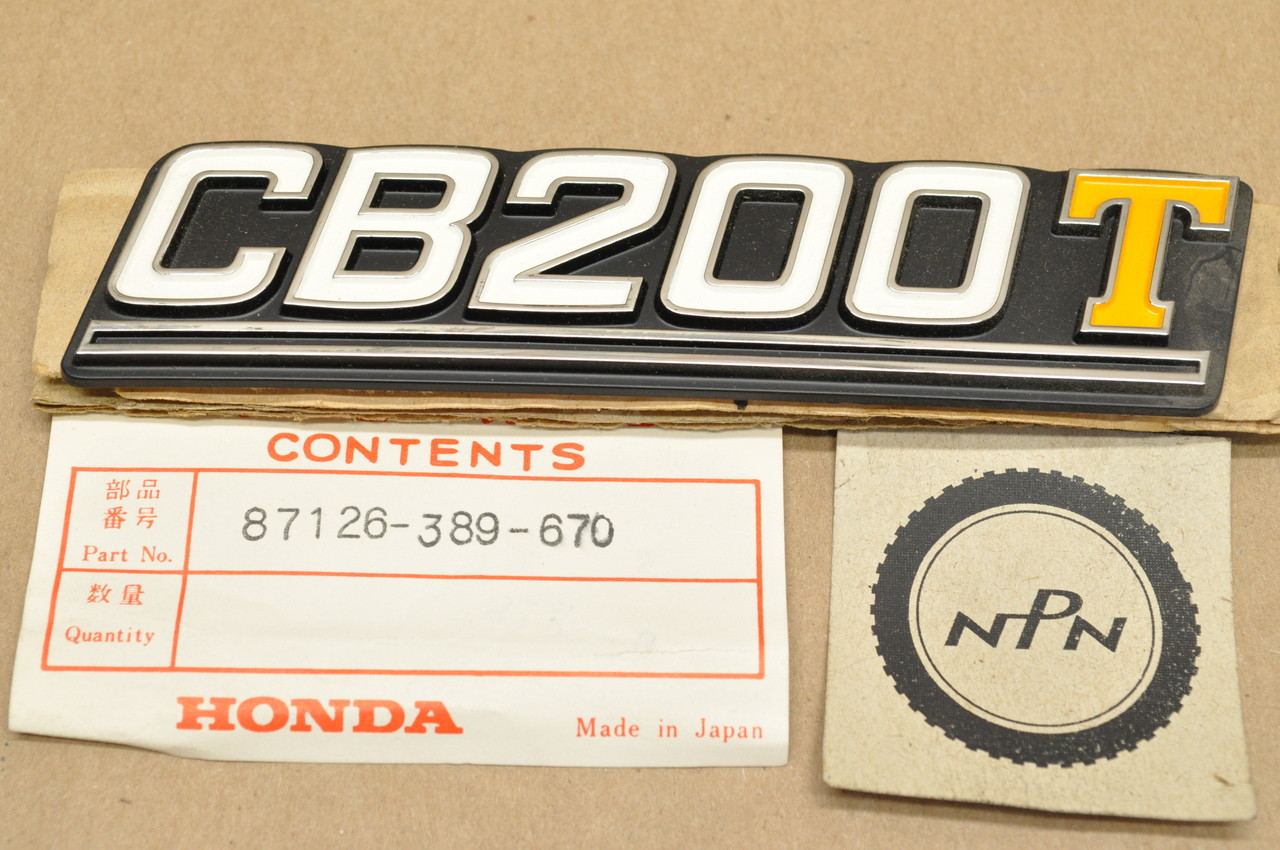 NOS Honda CB200 T Left Side Cover Badge Emblem 87126-389-670