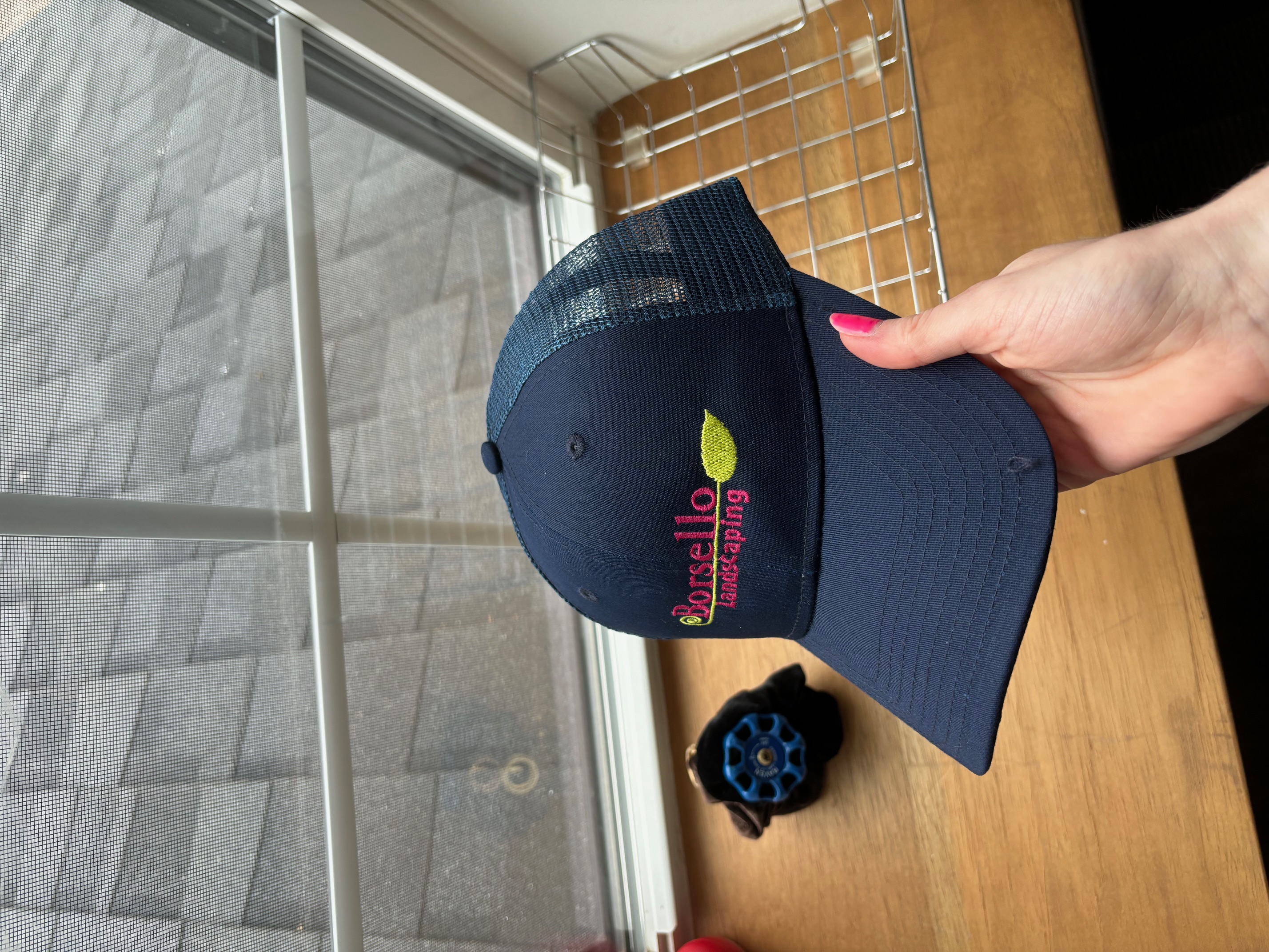 An office managers' experience working with CapsToYou - Borsello Landscaping's Branding Journey