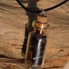 Red Tiger's Eye Stones in a Glass Vial on a Leather Cord Necklace