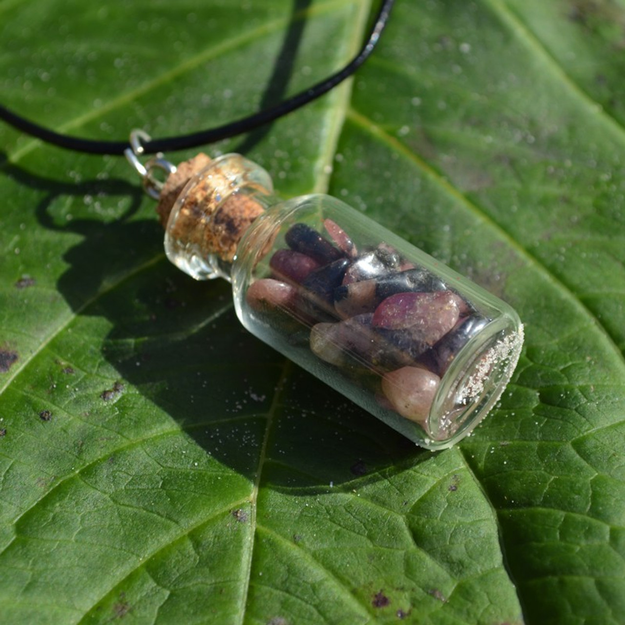 Rhodonite Stones in a Glass Vial on a Leather Cord Necklace