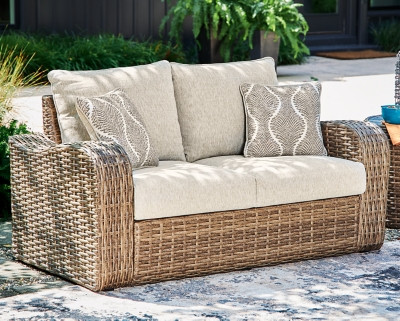 Ashley Sandy Bloom Beige Outdoor Loveseat with Cushion