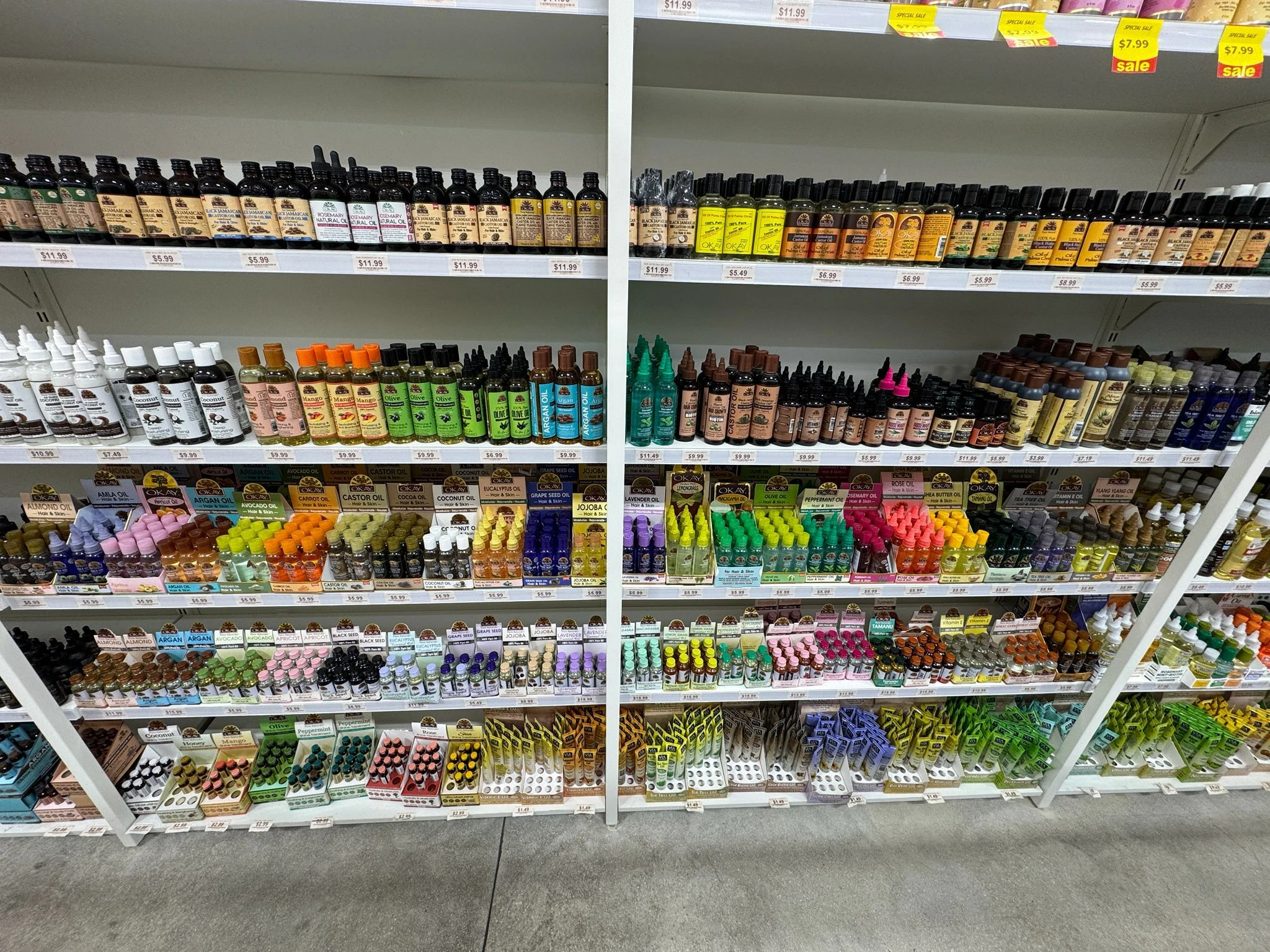 OKAY Pure Naturals oils and beauty products shelf