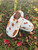 TAN COW PRINT PLATFORM SLIPPER
