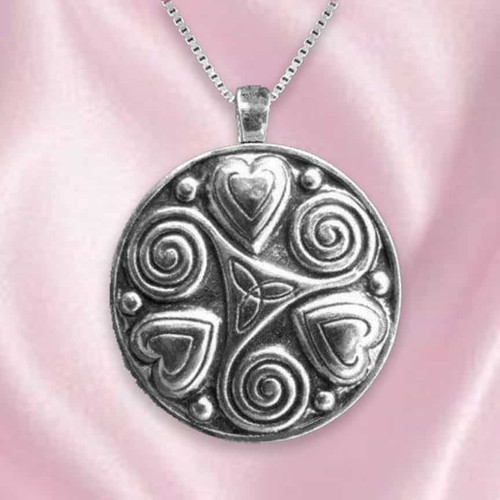Sterling silver pendant featuring two interwoven spiral hearts, symbolizing eternal love and connection. The polished silver design shines with elegant Celtic-inspired curves.