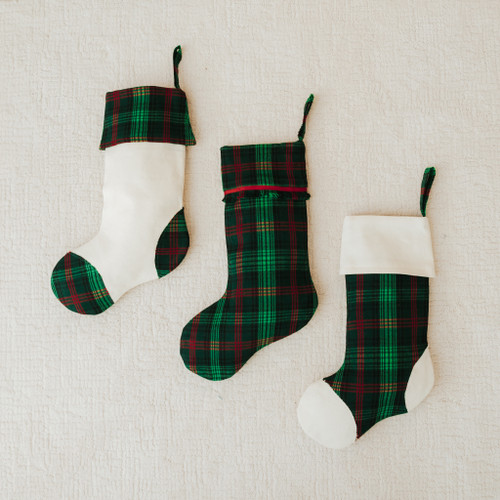 Three green and red tartan Christmas stockings