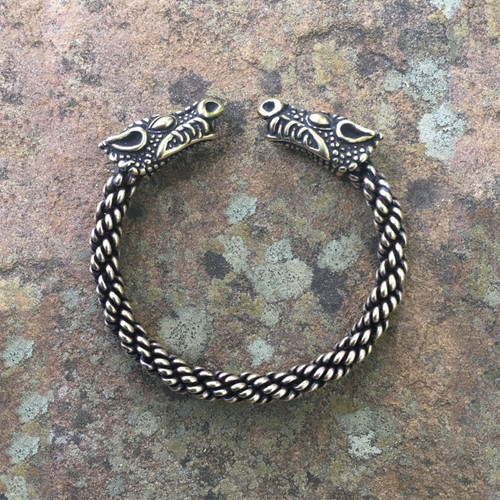 Dragon head terminal detail on bronze Celtic torc bracelet