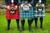 3 men wearing tartan kilts