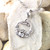 Sterling Silver Triquetra Claddagh Necklace on background