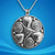 Sterling silver pendant featuring two interwoven spiral hearts, symbolizing eternal love and connection. The polished silver design shines with elegant Celtic-inspired curves.