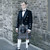 Man wearing a complete full formal prince charlie rental outfit with an Outlander Kilt