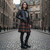 Woman wearing full grain leather Ghillie Boots with a traditional tartan kilt