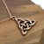 Copper triquetra necklace featuring a rustic Celtic Trinity Knot design.