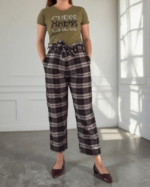 Cotton On Brown Check Print Pants front view worn on model with paperbag waist, belt tied in a bow & hands-in-pockets styling